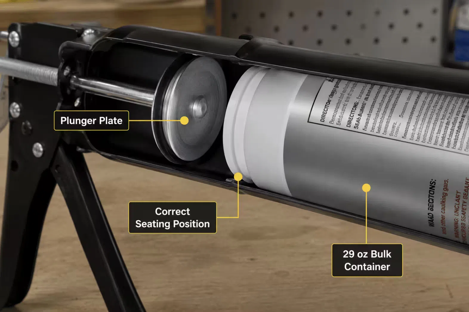 Bulk caulk gun barrel opened with plunger visible, showing the correct seating position for a 29 oz bulk sealant container