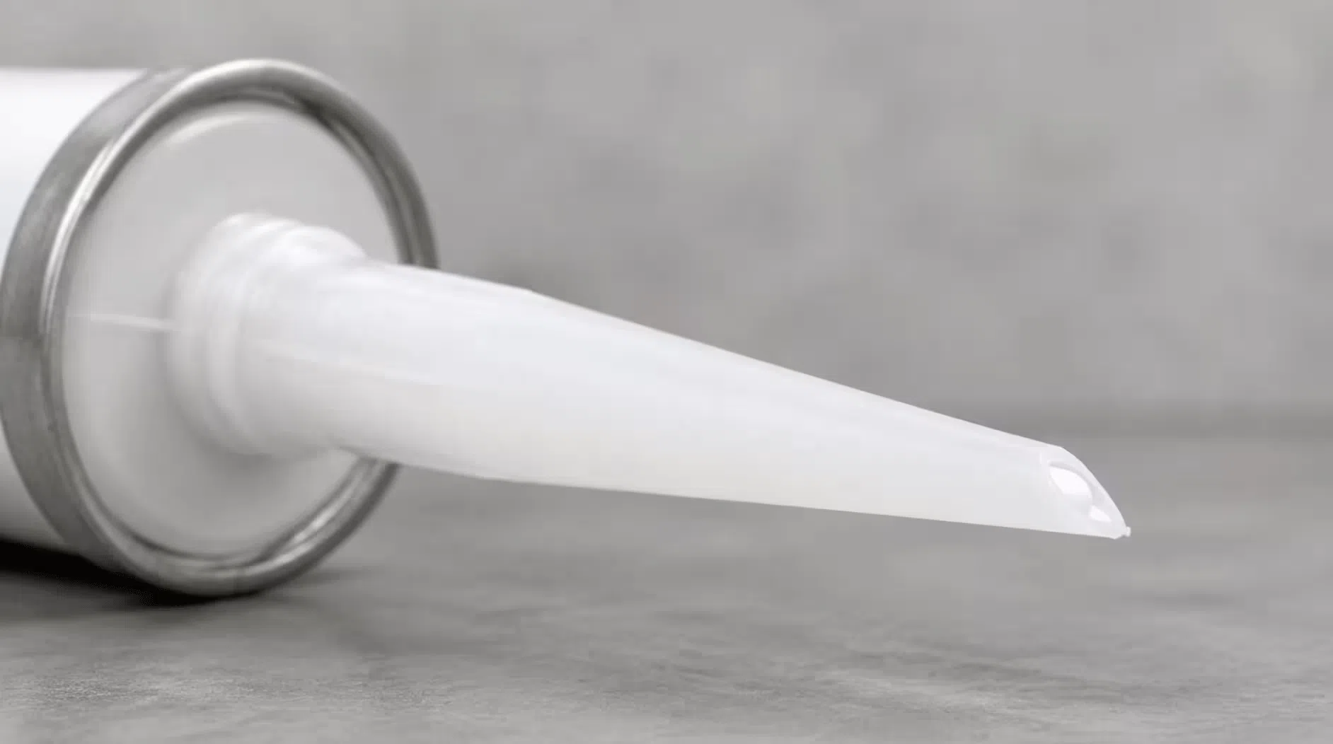 45-degree cut on a sealant cartridge nozzle showing the small opening used to control bead width and reduce drip